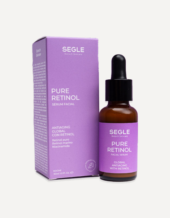 Frasco de sérum con pipeta, envase de vidrio ámbar y etiqueta minimalista sobre fondo de color lavanda.